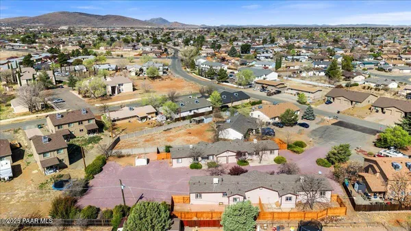 an aerial view of residential houses with outdoor space