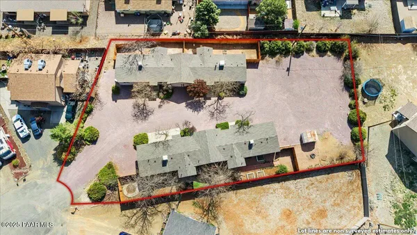 an aerial view of a house with outdoor space