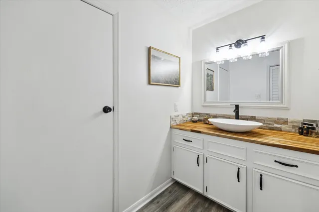 a bathroom with a double vanity sink and mirror
