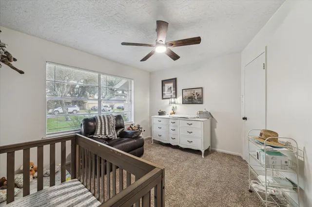 a bedroom with furniture and a window
