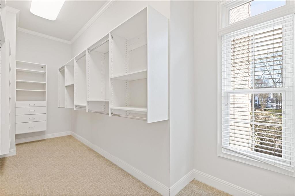 2010 Legends Way Braselton, GA 30517 - Photo 29 of 77 a view of walk in closet with empty racks