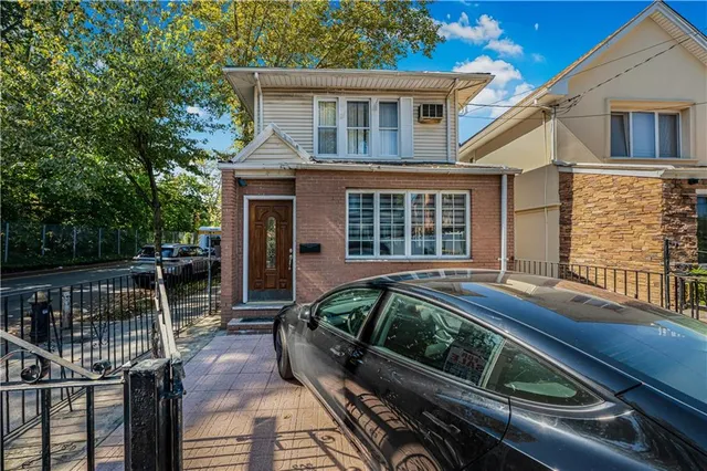 a view of house with swimming pool and sitting space