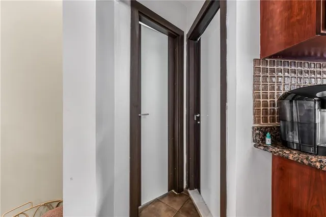 a view of a balcony and a car parked in front of it
