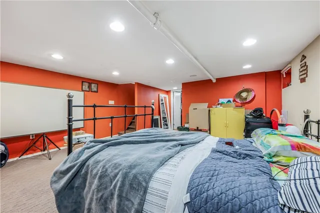 a bed room with a bed and a large window