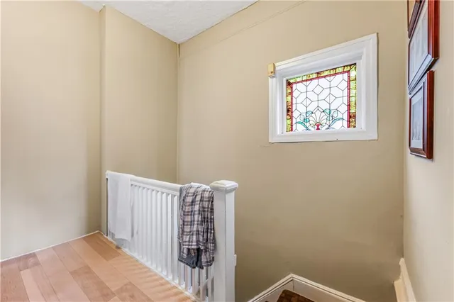 a view of a hallway with a white walls