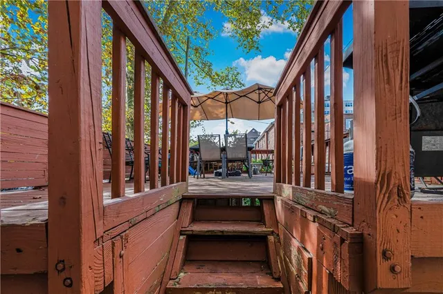 a view of balcony with couch and wooden floor