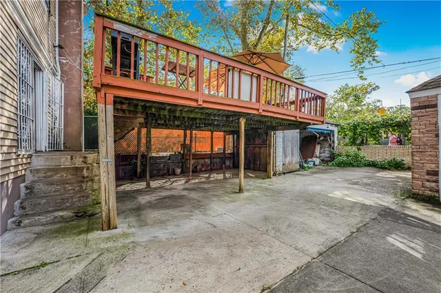a view of a house with a porch and furniture