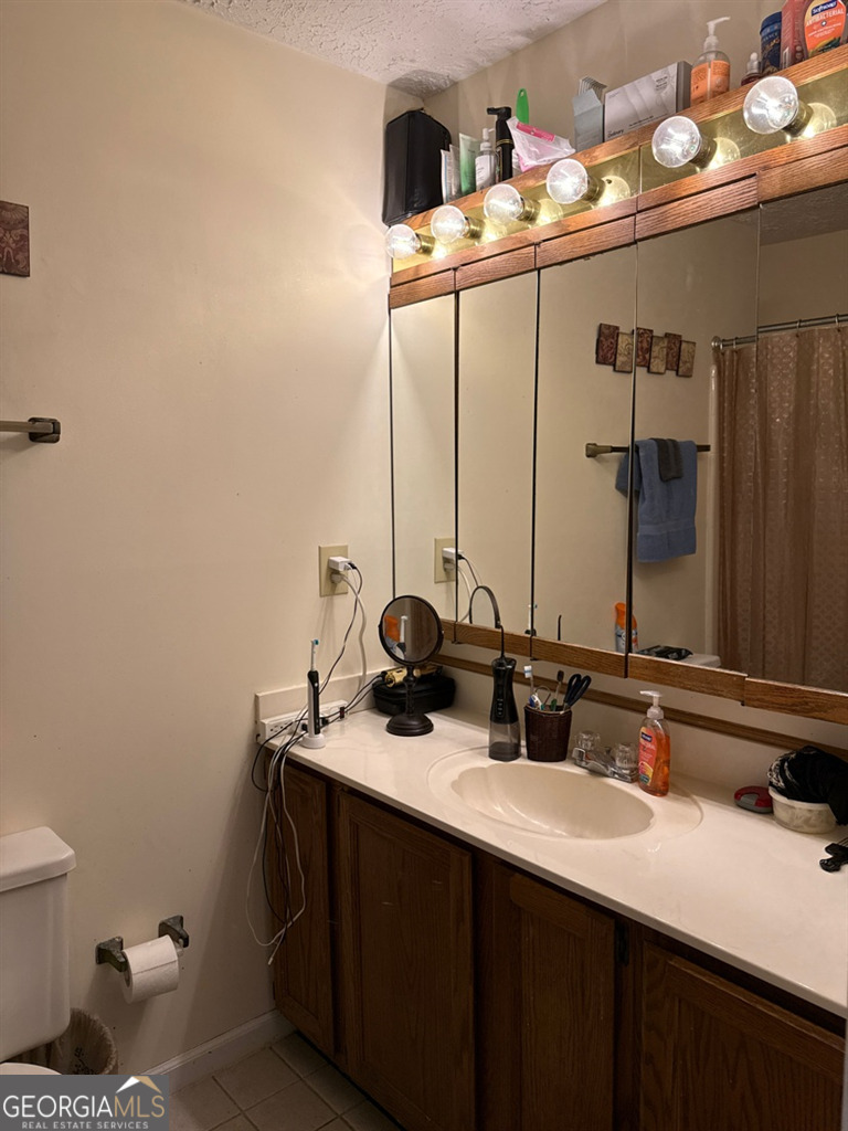 3994 Elm Street Atlanta, GA 30341 - Photo 11 of 15 a bathroom with a sink and a mirror