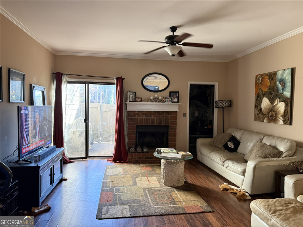 3994 Elm Street Atlanta, GA 30341 - Photo 3 of 15 a living room with furniture a fireplace and a flat screen tv