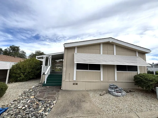 a front view of a house with garage