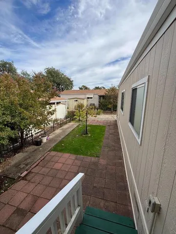 a view of a backyard with pathway