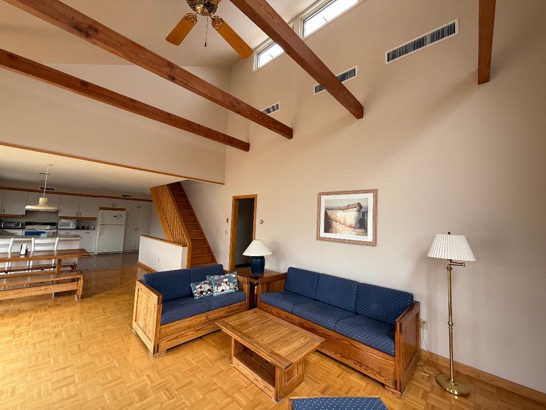 82 Oyster Pond Road Edgartown, MA 02539 - Photo 29 of 53 a living room with furniture and a table