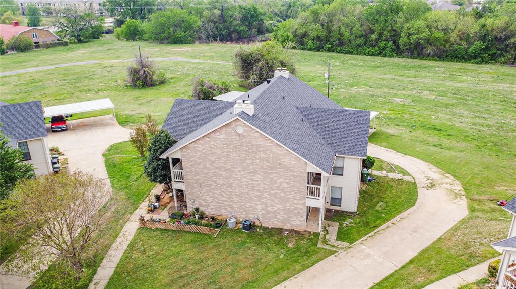 806 Treadwell Court, Unit B Hurst, TX 76053 - Photo 2 of 27 a view of a house with garden