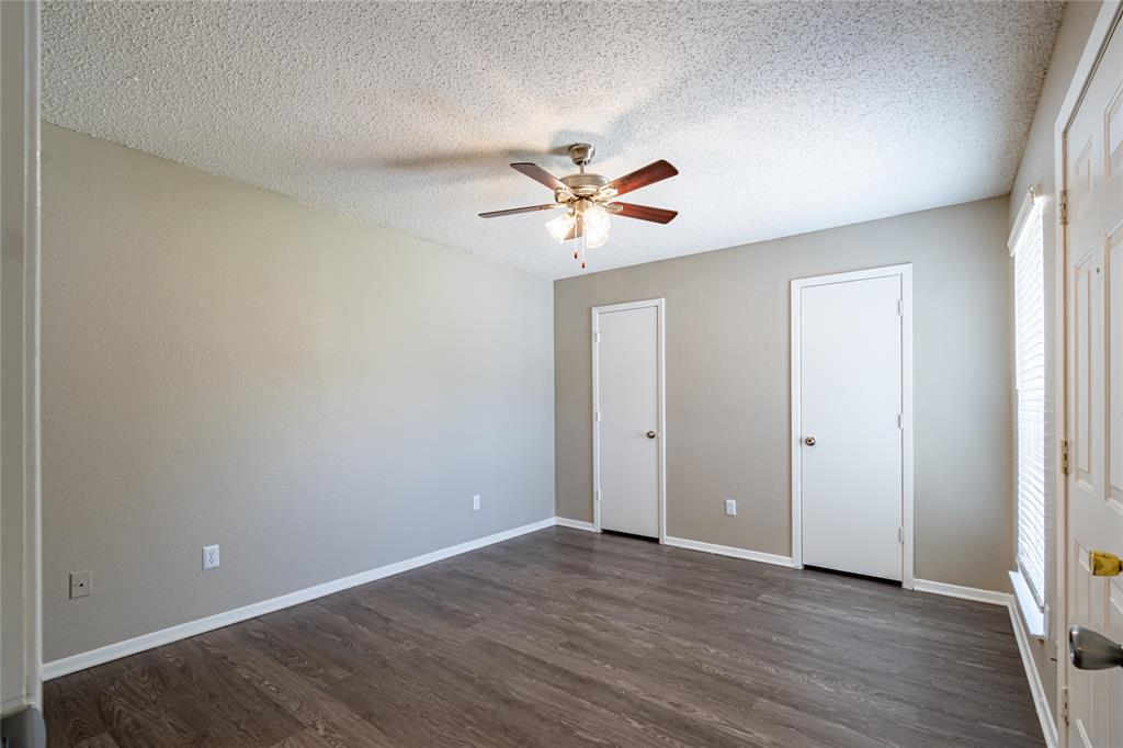806 Treadwell Court, Unit B Hurst, TX 76053 - Photo 21 of 27 wooden floor in an empty room