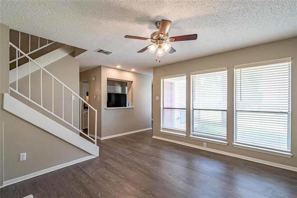 806 Treadwell Court, Unit B Hurst, TX 76053 - Photo 6 of 27 a view of an entryway with wooden floor