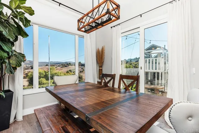 a living room with a table or chairs and a wooden floor