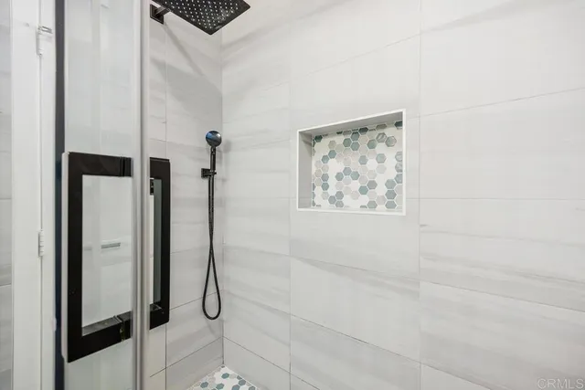 a bedroom with a bed and a bookshelf