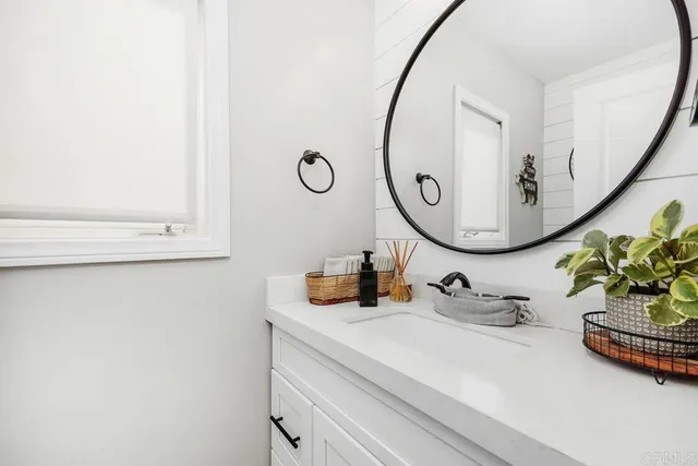 a living room with furniture and a book shelf