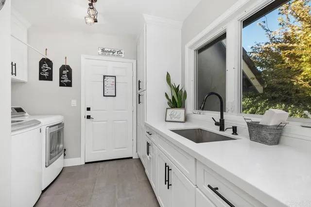 a view of a balcony with furniture and wooden floor