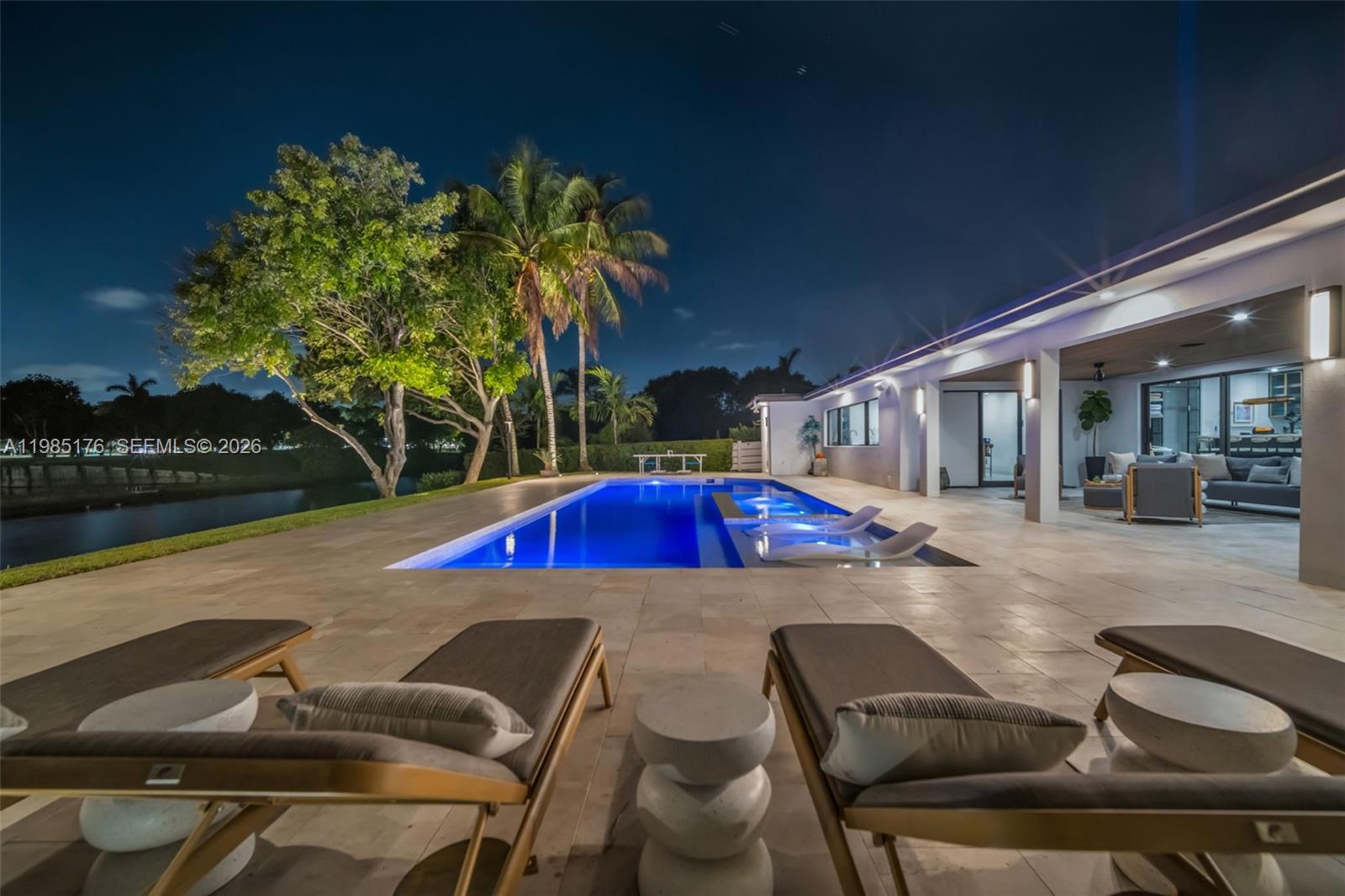 4430 Casper Court Hollywood, FL 33021 - Photo 59 of 64 a view of backyard with table and chairs and potted plants
