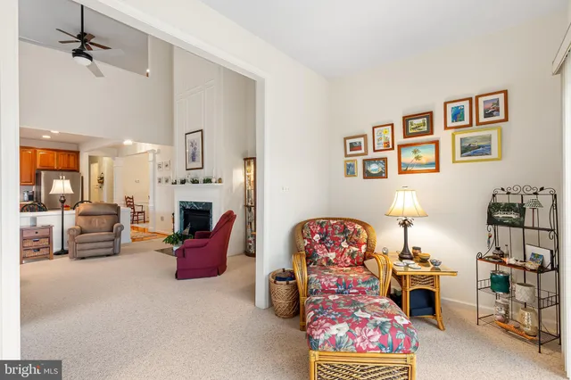 a living room with furniture toys and a fireplace