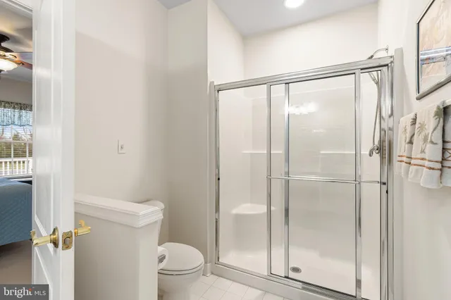 a bathroom with a glass shower door