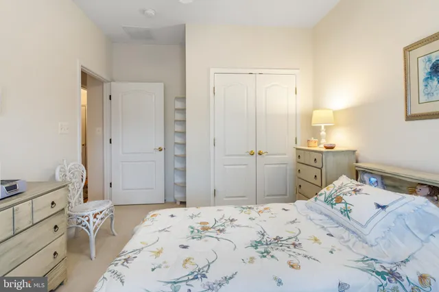 a bedroom with a bed and a cabinets