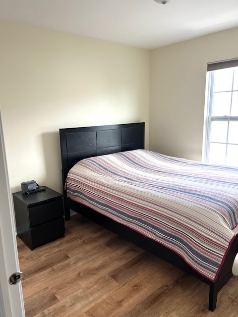 17 East Willow Road, Unit 17 Wheeling, IL 60090 - Photo 11 of 22 a bedroom with a bed and window