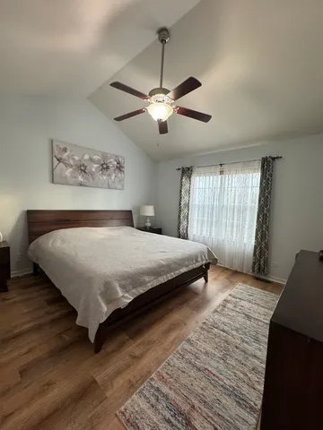 a bedroom with a bed and window