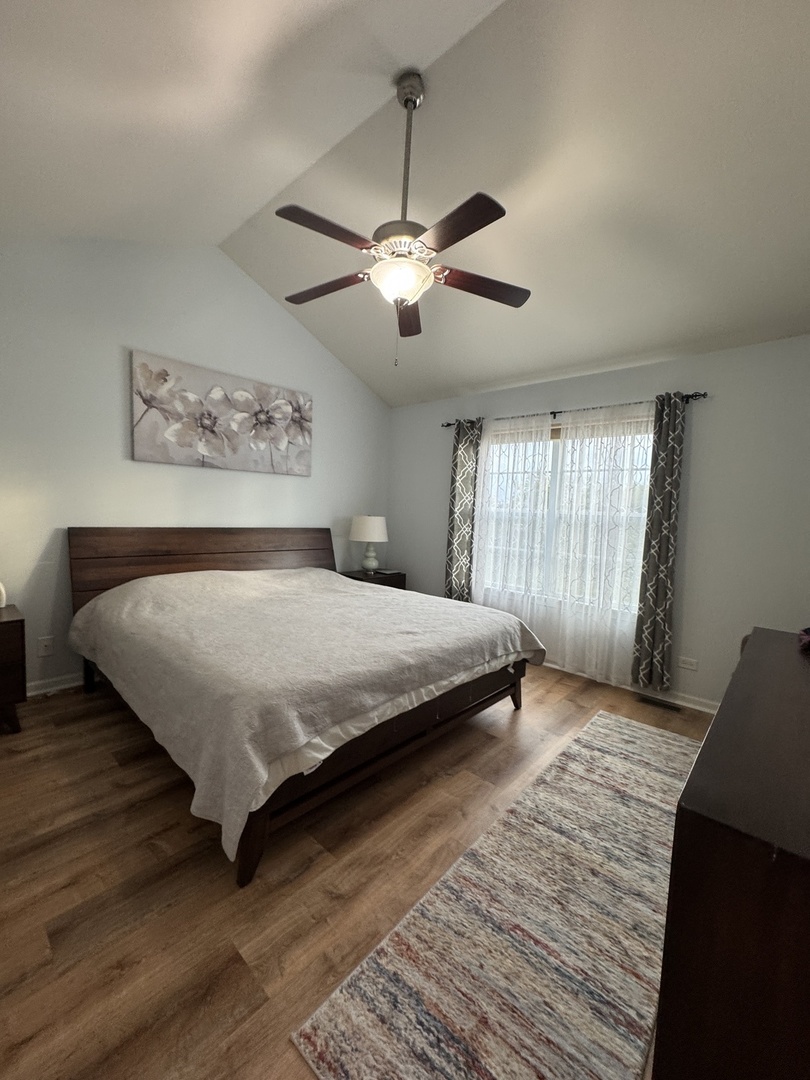 17 East Willow Road, Unit 17 Wheeling, IL 60090 - Photo 13 of 22 a bedroom with a bed and window