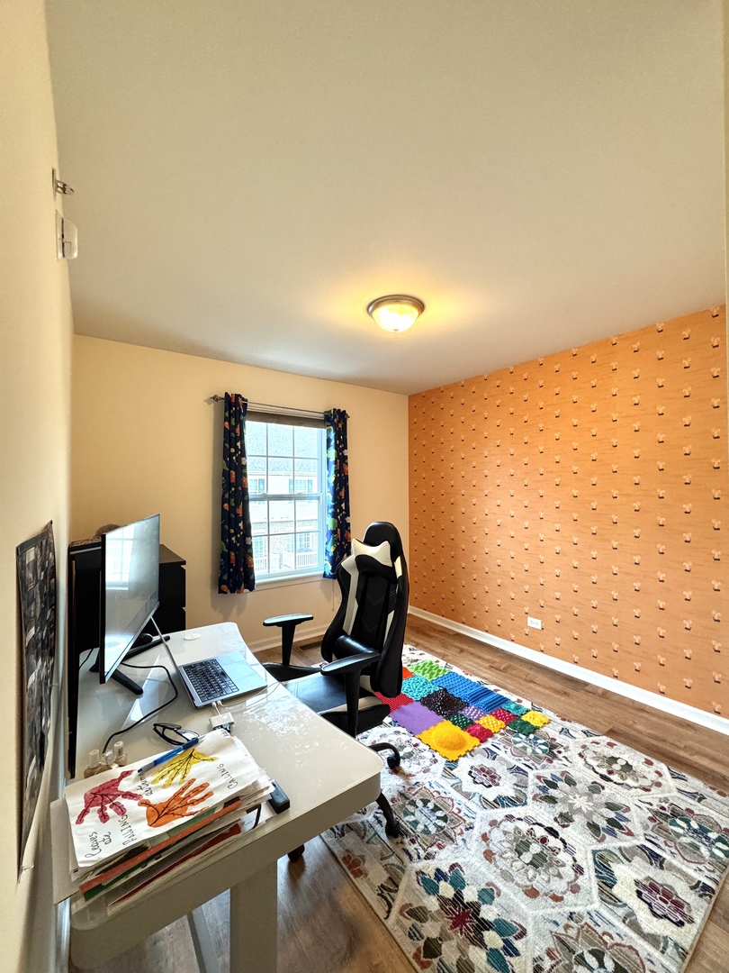 17 East Willow Road, Unit 17 Wheeling, IL 60090 - Photo 14 of 22 a view of a workspace with furniture and a window