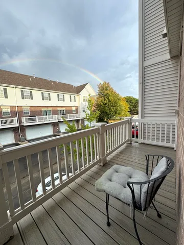 a view of a balcony with chairs
