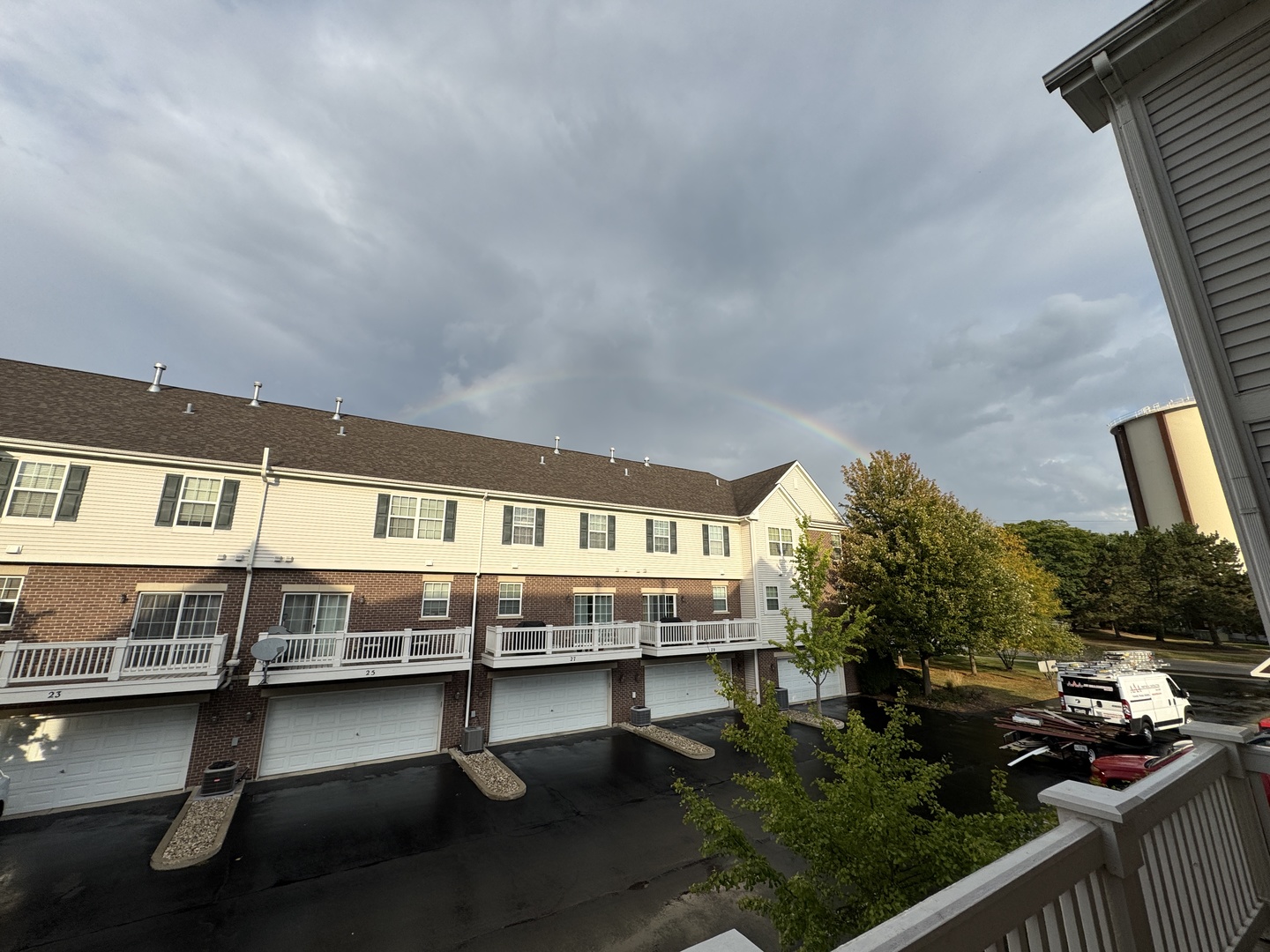17 East Willow Road, Unit 17 Wheeling, IL 60090 - Photo 20 of 22 a balcony with wooden benches and trees