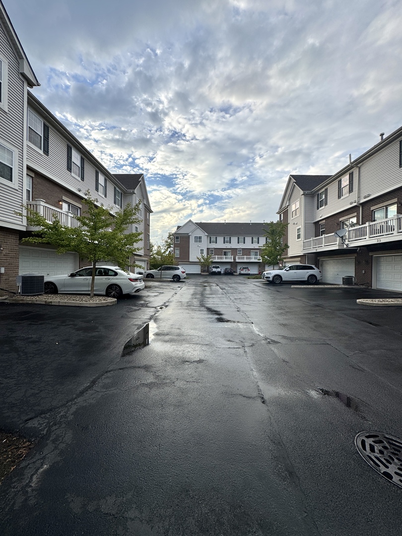 17 East Willow Road, Unit 17 Wheeling, IL 60090 - Photo 21 of 22 a city street lined with buildings and cars