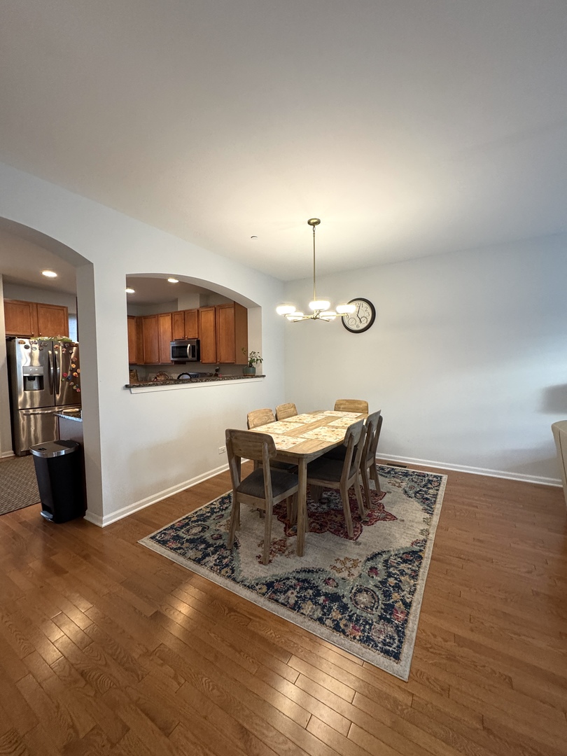 17 East Willow Road, Unit 17 Wheeling, IL 60090 - Photo 3 of 22 a view of a dining room with furniture