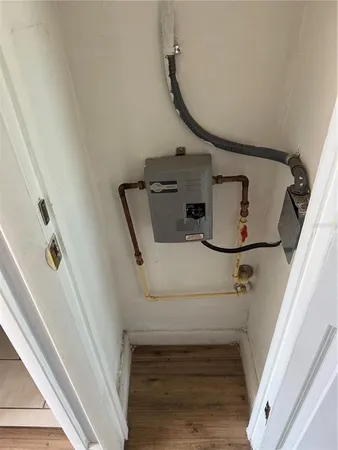 a view of staircase with white walls and railing