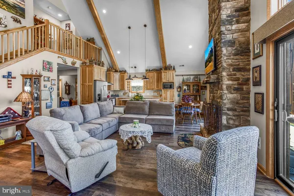 a living room with furniture or couch and a large window