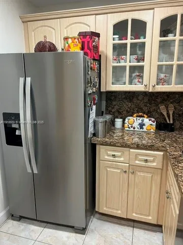 a bedroom with a bed and a lamp