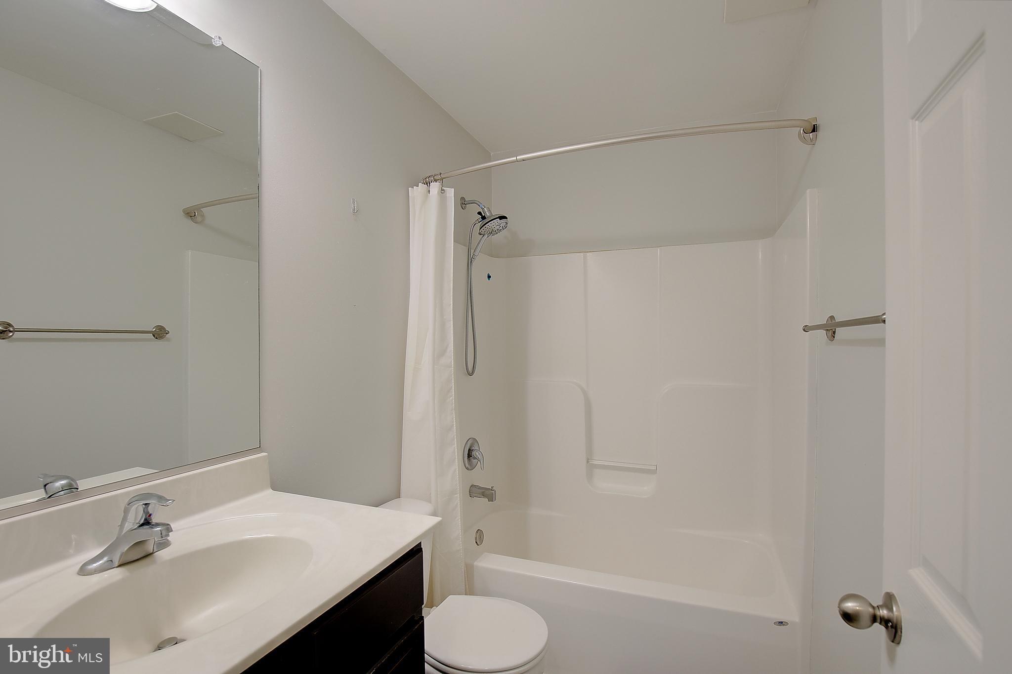 403 Venton Road Edgewater, MD 21037 - Photo 27 of 62 a bathroom with a sink toilet and shower
