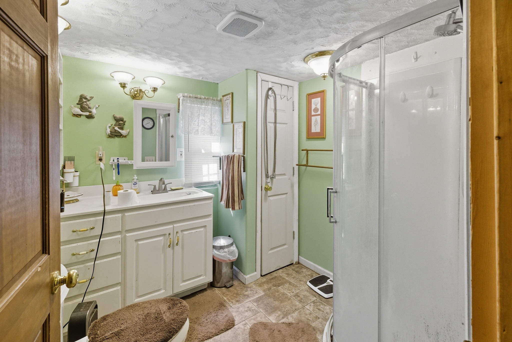 207 Center Street Portland, TN 37148 - Photo 11 of 24 a spacious bathroom with a shower sink mirror and toilet