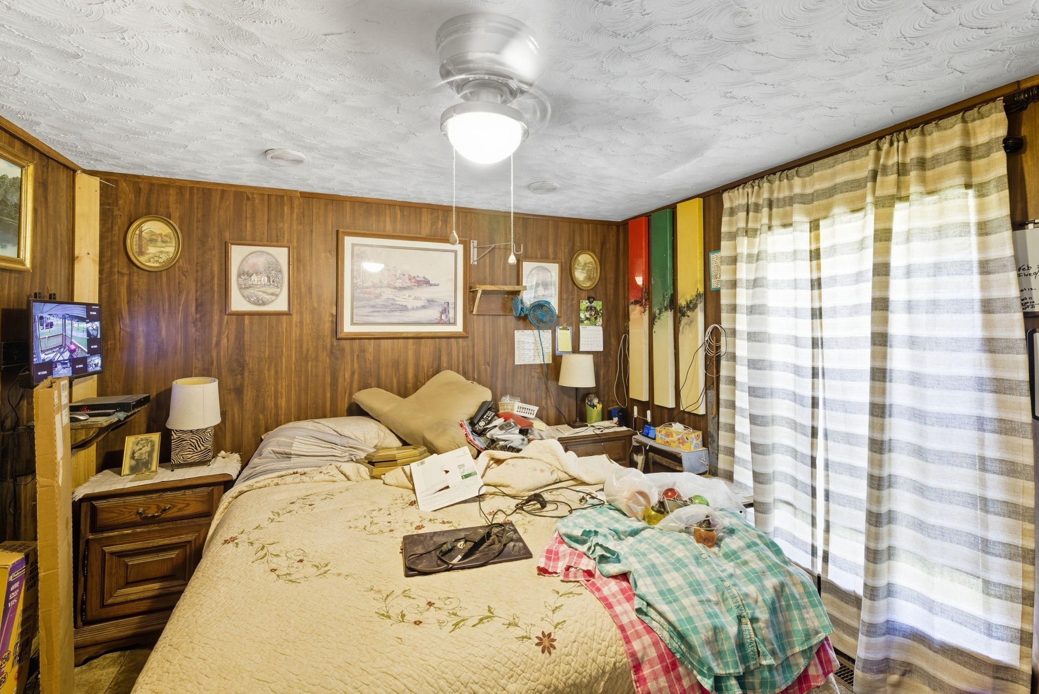 207 Center Street Portland, TN 37148 - Photo 15 of 24 a bedroom with a bed and wooden floor