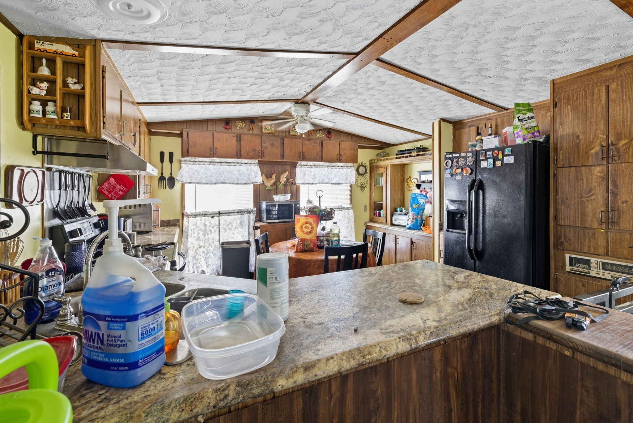 207 Center Street Portland, TN 37148 - Photo 18 of 24 a kitchen with lots of wooden furniture and appliances