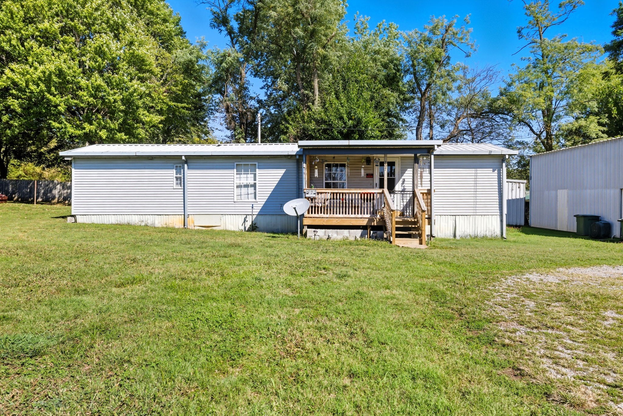 207 Center Street Portland, TN 37148 - Photo 22 of 24 a front view of house with yard and seating area