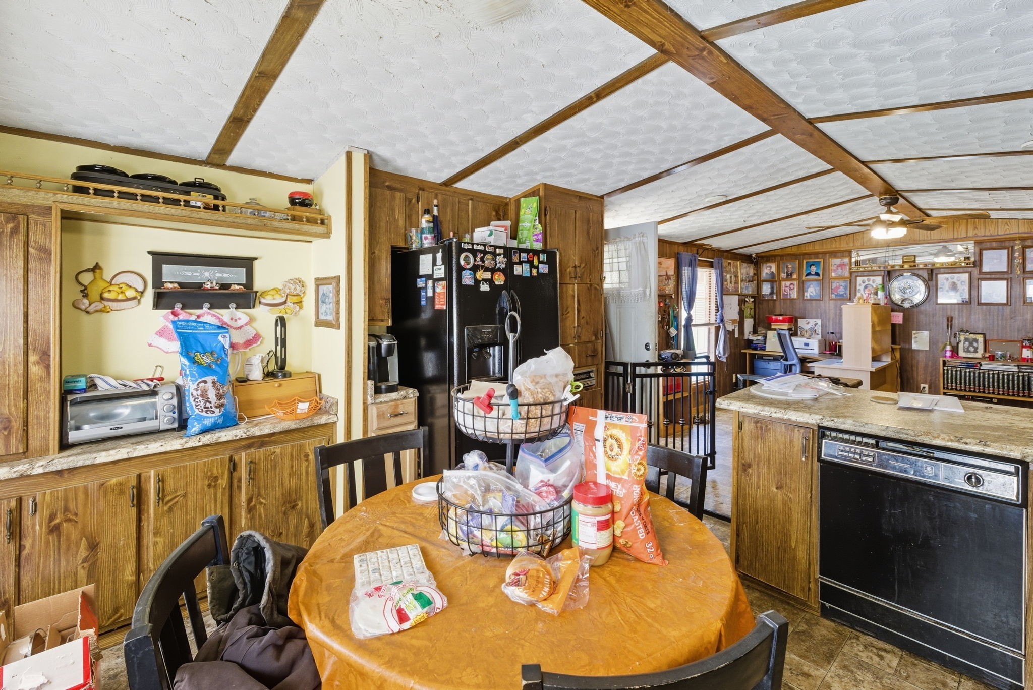 207 Center Street Portland, TN 37148 - Photo 7 of 24 a view of a dining room with furniture a chandelier and wooden floor