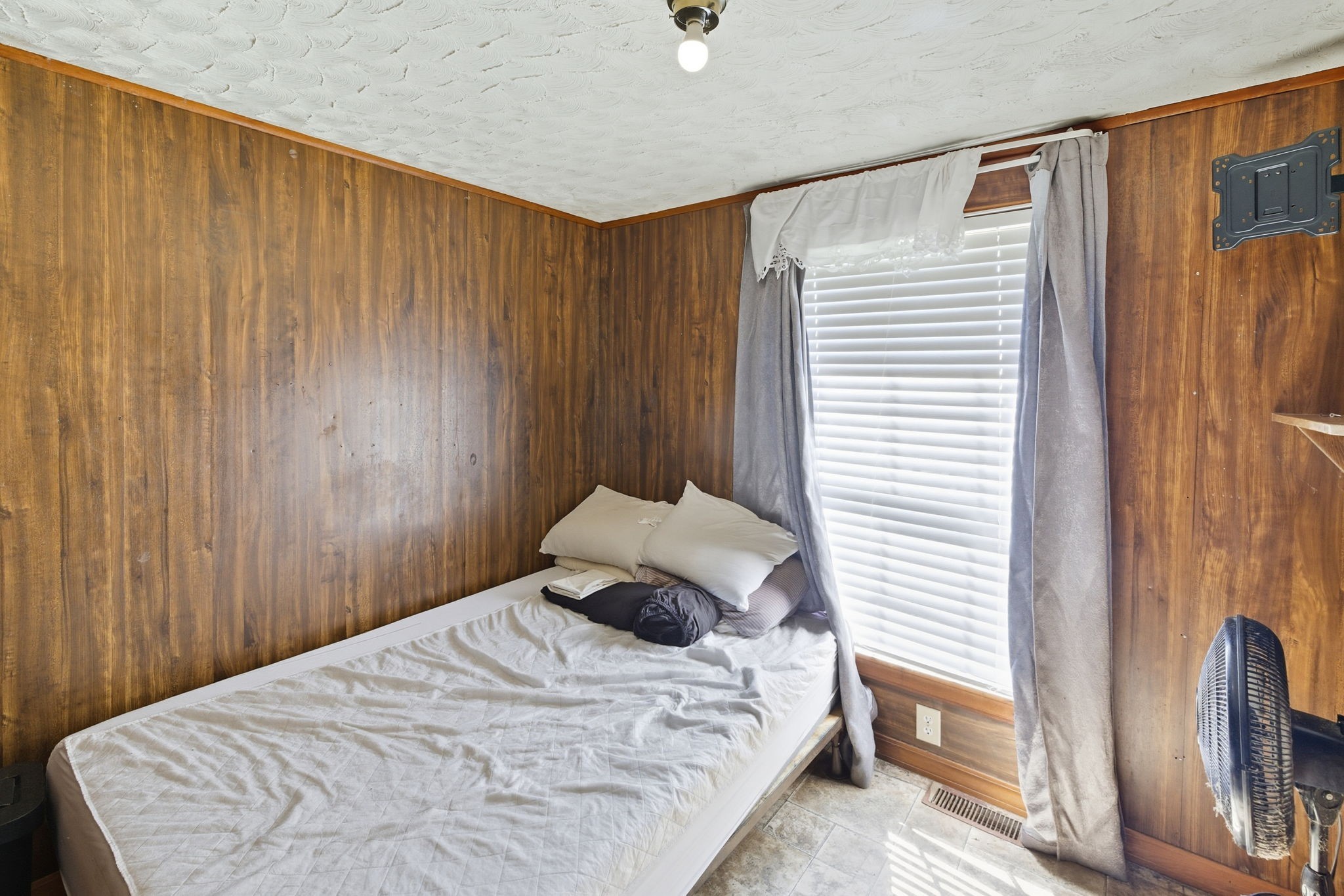 207 Center Street Portland, TN 37148 - Photo 10 of 24 a bedroom with a bed and wooden floor