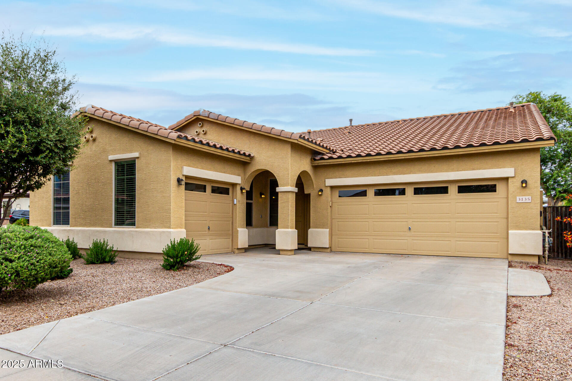 3135 East Ridgewood Lane Gilbert, AZ 85298 - Photo 1 of 39 a front view of a house with yard