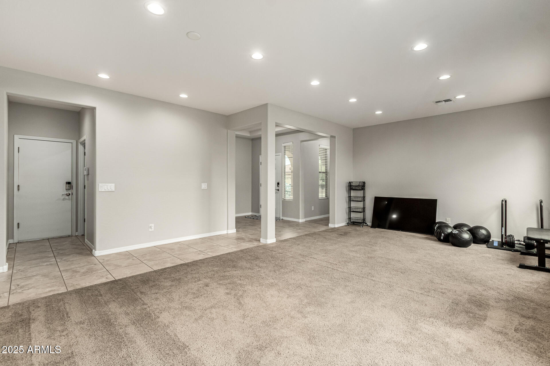 3135 East Ridgewood Lane Gilbert, AZ 85298 - Photo 17 of 39 an empty room with garage and car parked