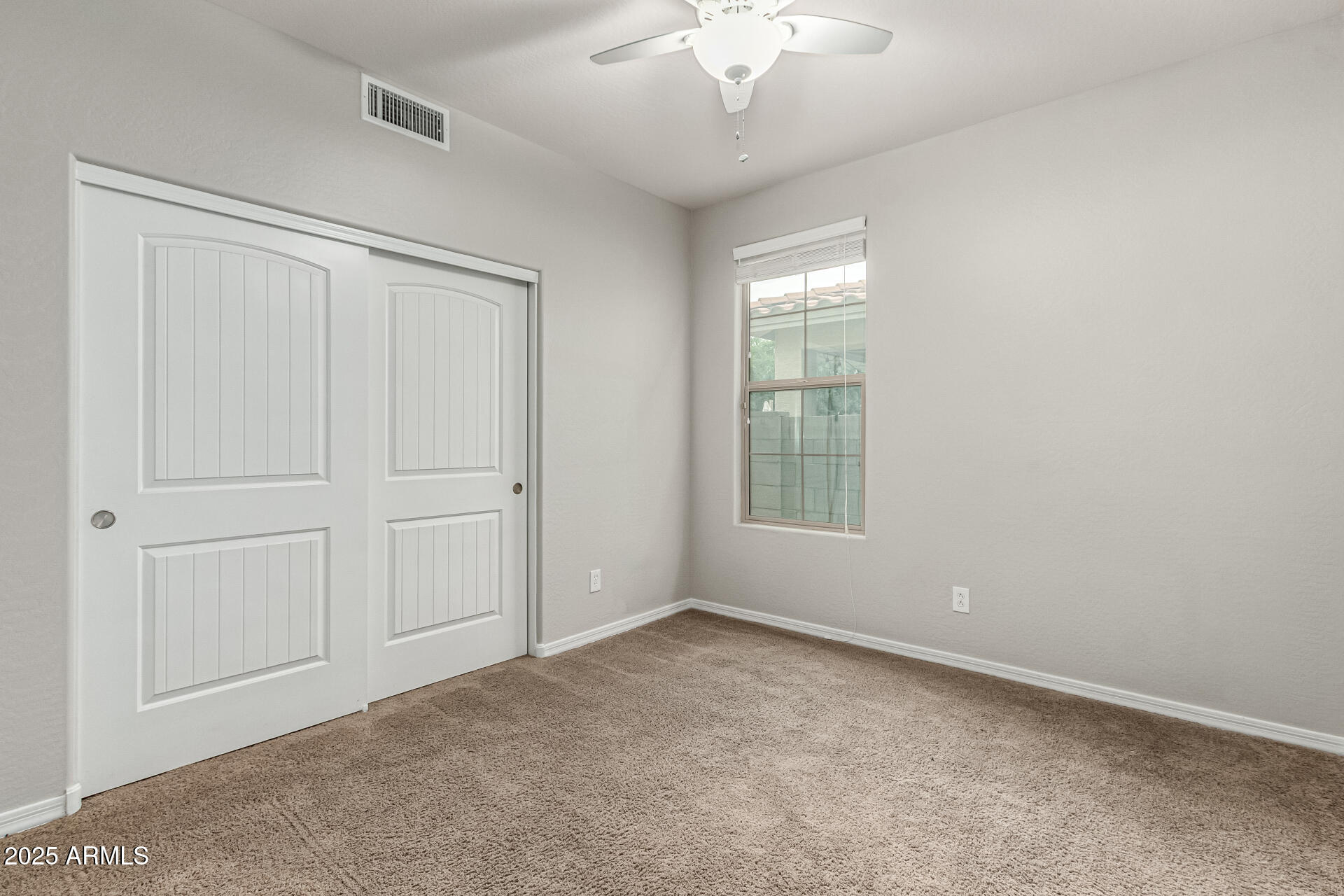 3135 East Ridgewood Lane Gilbert, AZ 85298 - Photo 20 of 39 a view of an empty room with a window