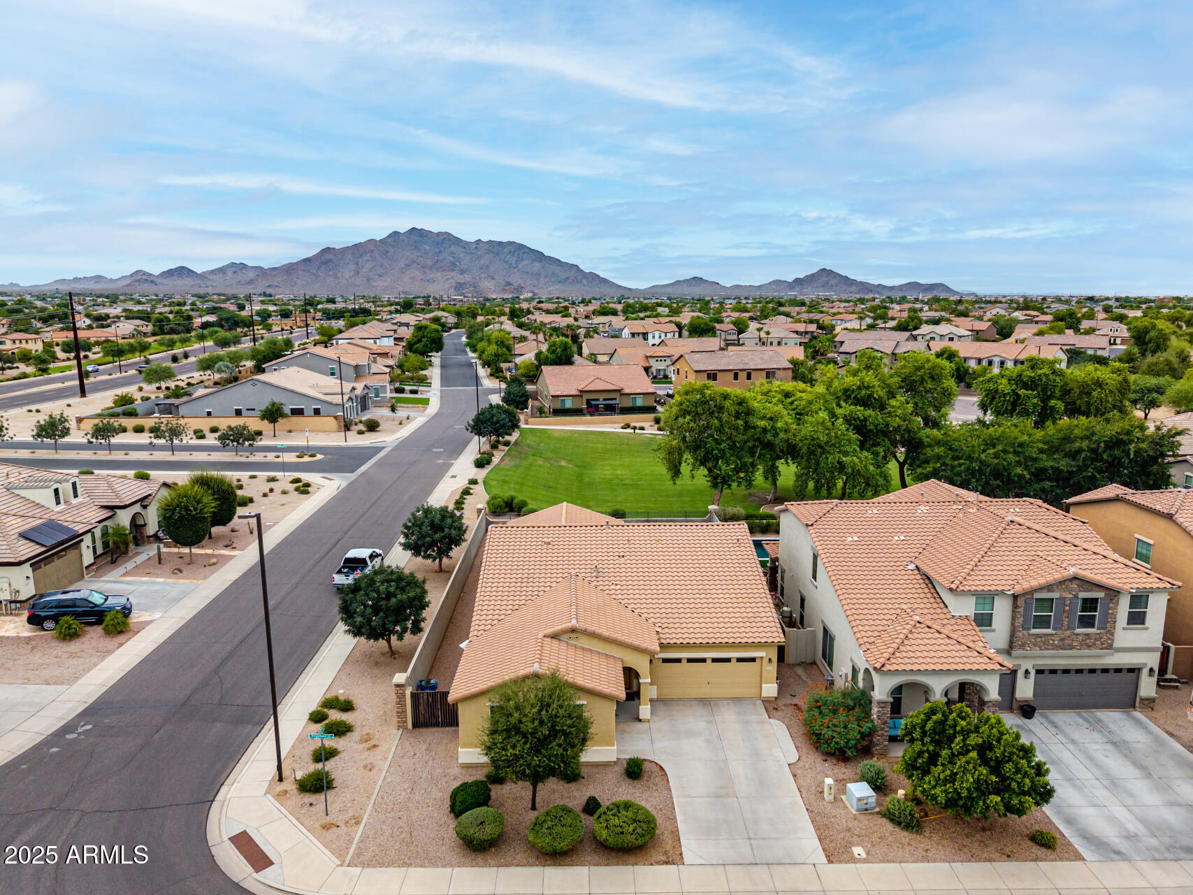 3135 East Ridgewood Lane Gilbert, AZ 85298 - Photo 3 of 39 an aerial view of residential houses with outdoor space and ocean view