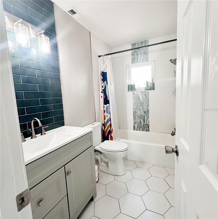 3208 Timberline Road Winter Haven, FL 33880 - Photo 11 of 21 a bathroom with a sink toilet and shower